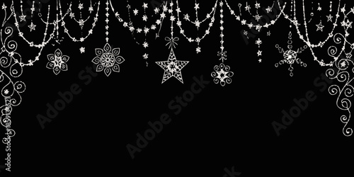 Delicate silver christmas ornaments and garlands hanging against a dark background