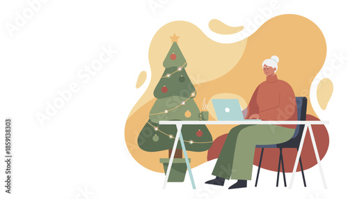 Senior woman working on a laptop at a desk next to a cozy decorated Christmas tree