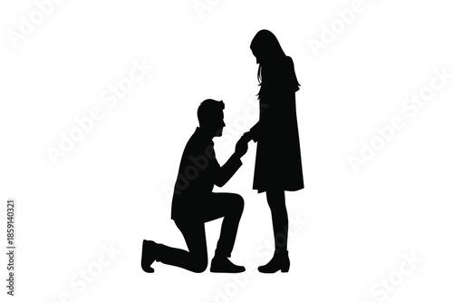 A silhouetted scene depicts a heartfelt proposal a man kneeling and presenting a ring to a woman high quality