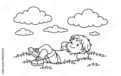 Young boy relaxing on the grass under a cloudy sky, enjoying a peaceful moment