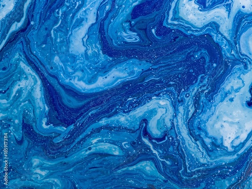 Abstract blue marble texture with swirling liquid patterns. Natural stone inspired background expressing depth, movement, and modern elegance.