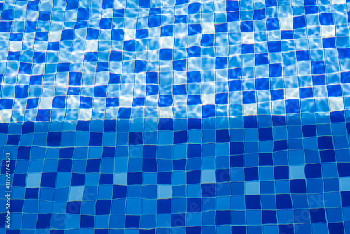 Blue Swimming Pool Tiles with Water Ripples and Light Reflection