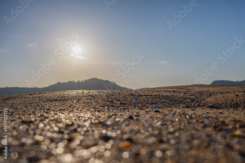 Golden Sand Texture at Low Tide with Distant Hills