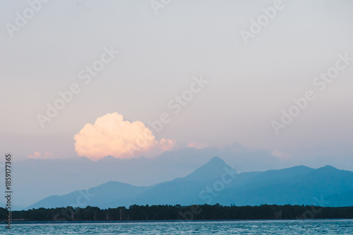 Soft Pastel Cloud Over Coastal Mountains at Dusk
