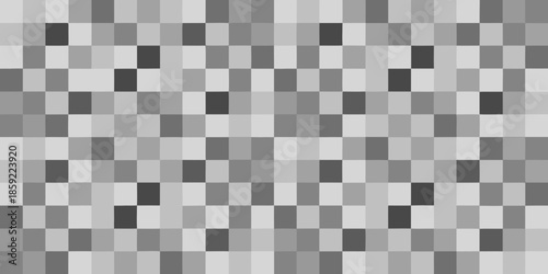 A grayscale image composed of many small varying shades of gray squares
