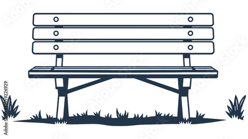 A simple park bench sits on grass with shadows.