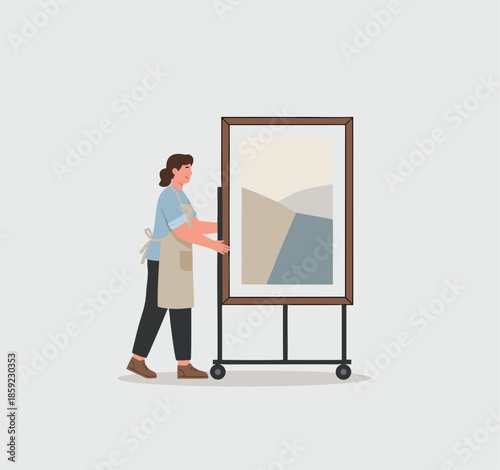 Artist arranging abstract art on a mobile easel.