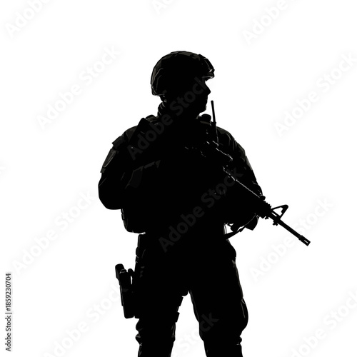 Silhouette of a soldier standing with a rifle and communication device