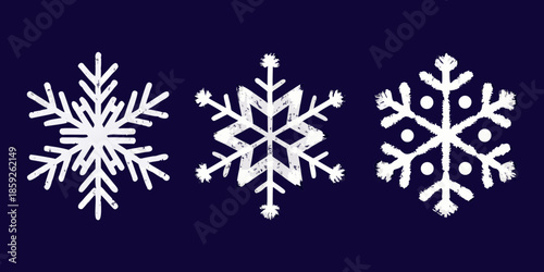 Three unique white snowflake illustrations against a dark blue background