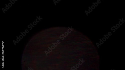 glare of light in the lens on a black background	