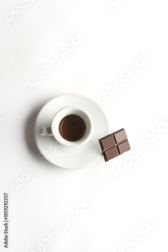 Cup of coffee with chocolate  on white background. Cup of espresso.Top view
