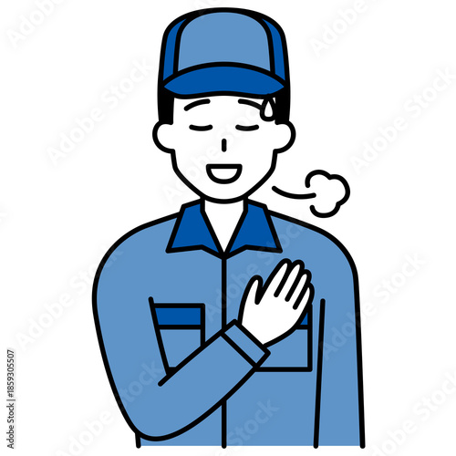 胸に手を当ててホッとするつなぎ作業服の男性