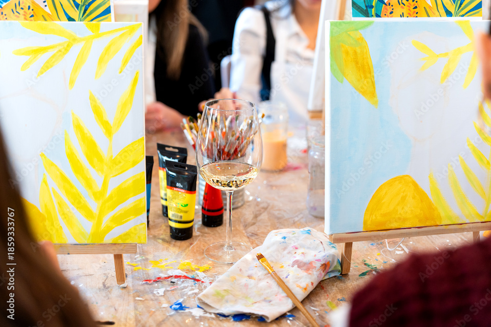 Fototapeta premium Women enjoying sip and paint art workshop