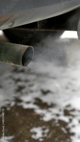 Car exhaust. Environmental issues. Smoke from a car tailpipe.