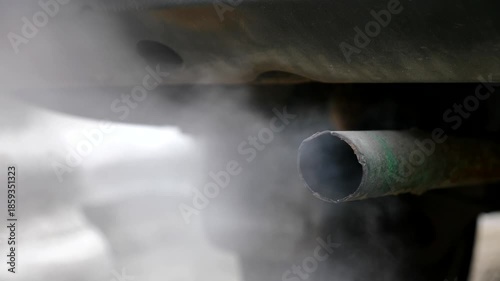 Car exhaust. Environmental issues. Smoke from a car tailpipe.