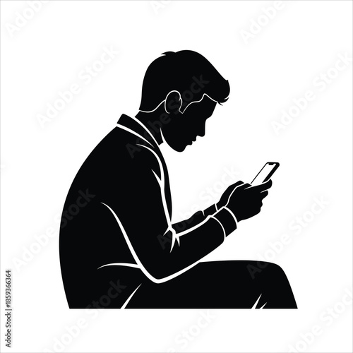 Silhouette of man sitting and looking at smartphone screen intently