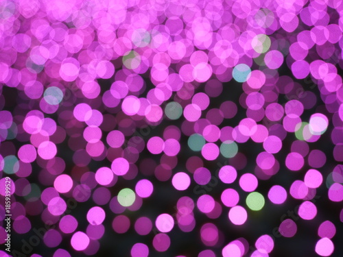 Abstract Bokeh from indoor lighting, Pink with blue with red with white and purple circles, Night city light background for celebration of christmas and holiday season