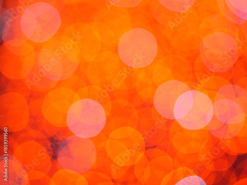 Abstract Bokeh from indoor lighting, Pink with red with orange with gold and yellow circles colored surface, Night city light background for celebration of christmas and holiday season