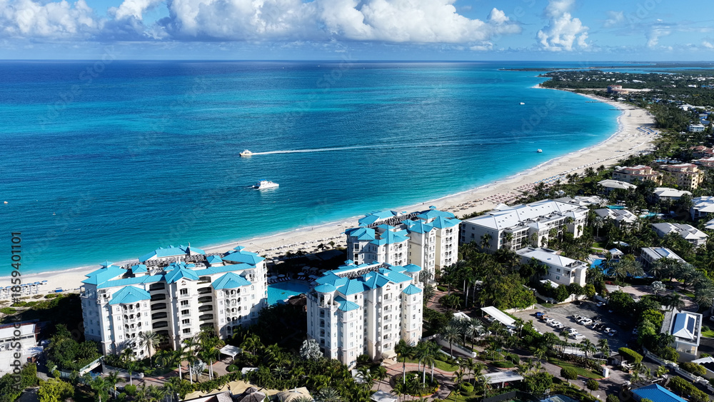 Fototapeta premium Grace Bay At Turks And Caicos In Overseas Territory United Kingdom. Stunning Cityscape. Beach Landscape. Highrise Buildings. Grace Bay In Turks And Caicos United Kingdom. Caribbean Background.