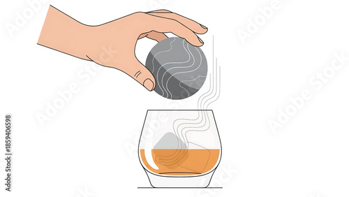 A hand places a chilling stone into a rocks glass with amber liquid. The stone and glass are in clean lines against white