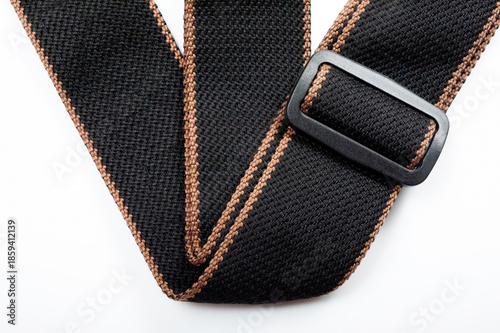 Black fabric strap for electric or acoustic guitar.