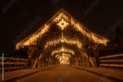 the famous historic wooden bridge of Bremgarten, Switzerland ist decorated for christmas