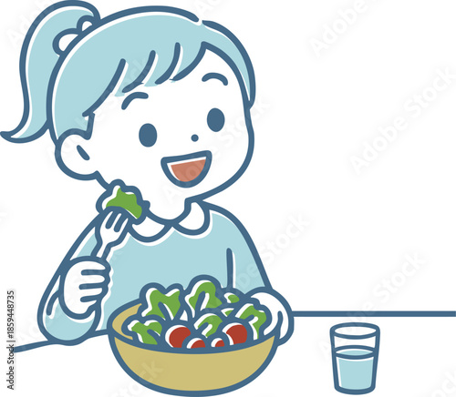 サラダを食べている笑顔の女の子