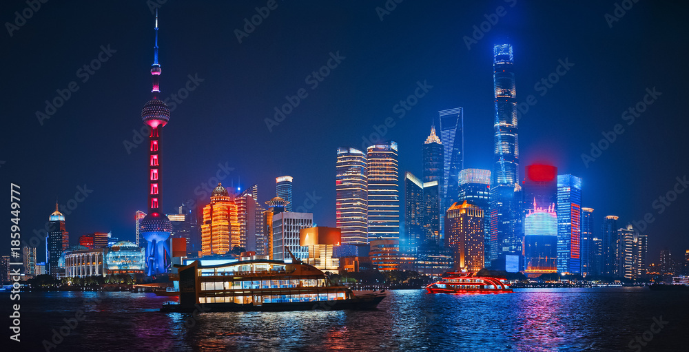 Fototapeta premium Colorful Shanghai Skyline Reflection in Water During a Bright Night