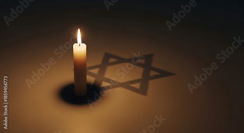 A single lit candle casts a Star of David shadow, symbolizing faith and remembrance