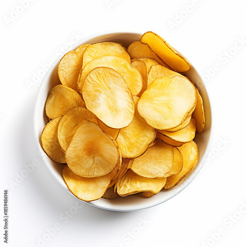 Flat lay of golden potato chips in a white bowl on white background,