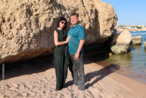 Mature couple in love on the beach casual clothes.