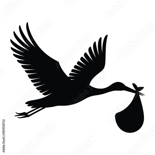 A silhouette of a stork in flight carrying a bundle