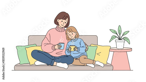 A mother and daughter are sitting on a sofa, holding cups and enjoying a warm drink together.