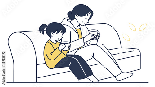 Mother and daughter sitting on sofa using mobile phones together.