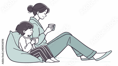 A mother and child enjoying a warm beverage together while relaxing on a beanbag chair.