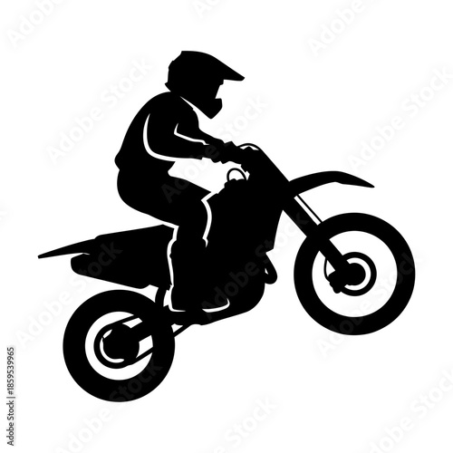 Dynamic silhouette of an off-road dirt bike rider performing a powerful wheelie