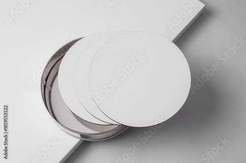 White round coasters on a light background