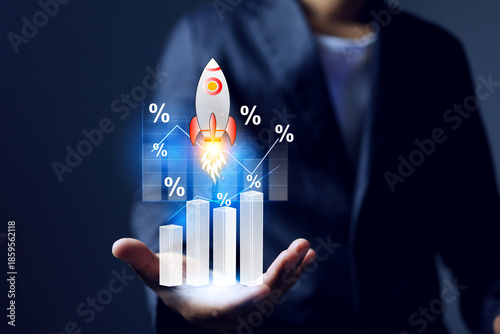 Photos growing up concept with businessman holding rocket rising represent to business