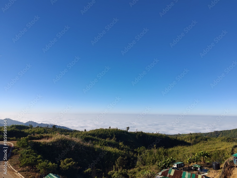Fototapeta premium Peaceful mountain nature landscape at sunrise with clouds