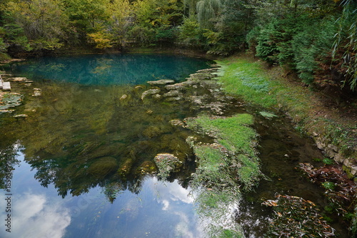 Waterfall on the river with reflection in water