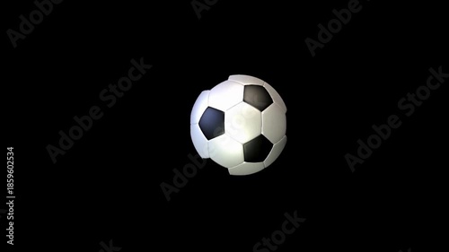 The lone soccer ball with black and white pentagons rests centered against a stark black background!