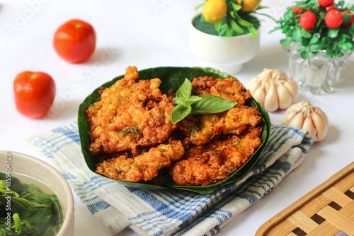 Принти на полотні Bakwan jagung, a beloved Indonesian fritter, is made from sweet corn mashed with aromatic spices, topped with shrimp, then deep-fried to golden crispness