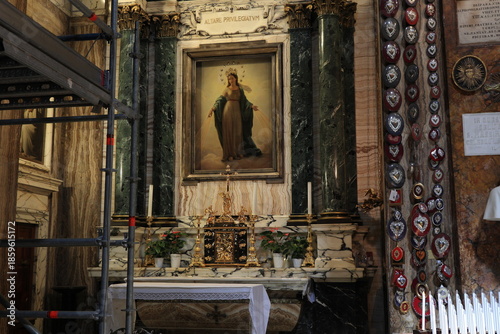 Chapel at Sant'Andrea delle Fratte Basilica with Votive Hearts and Scaffolding in Rome, Italy