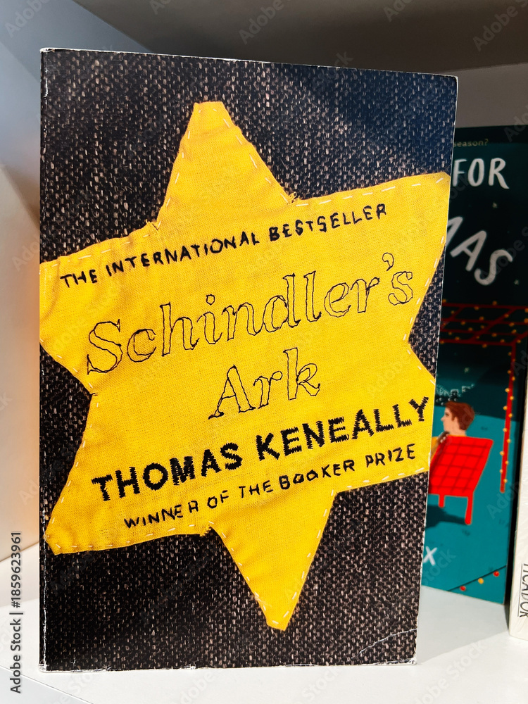 Fototapeta premium Schindler's Ark by Thomas Keneally on a yellow star book cover display
