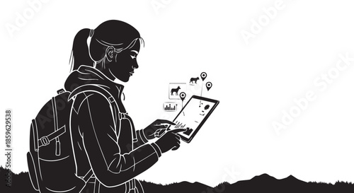 Woman hiker utilizing tablet technology for animal tracking and outdoor exploration