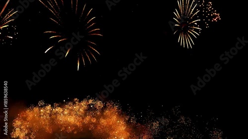 4K. loop seamless of real fireworks background golden shining fireworks with bokeh lights in the night sky. glowing fireworks show. New year's eve fireworks celebration multiple colors 