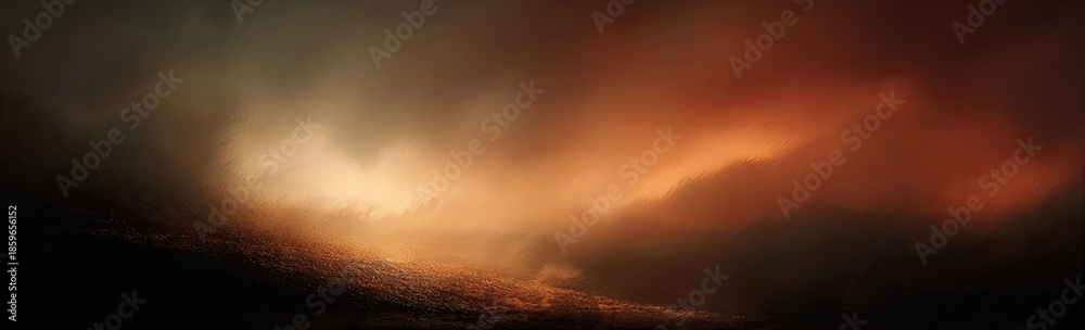Fototapeta premium A warm, fiery sky dominates, with dark, indistinct shapes in the foreground; dramatic lighting