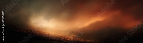 A warm, fiery sky dominates, with dark, indistinct shapes in the foreground; dramatic lighting