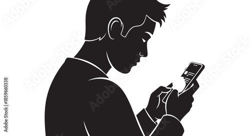 Man engrossed in his smartphone, texting or browsing on a mobile device in a silhouette
