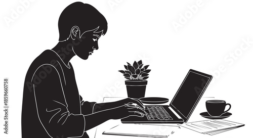 A focused person engrossed in work on a laptop at a desk with coffee and a plant